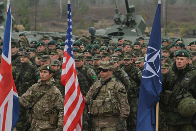 U.S. Soldiers from the Fort Hood, Texas-based 2nd Battalion, 8th Cavalry Regiment, 1st Brigade Combat Team, 1st Cavalry Division, and the Vilseck, Germany-based 1st Squadron, 2nd Cavalry Regiment, participate in closing ceremonies for Iron Sword 2014, in Pabrade, Lithuania, Nov. 13, 2014.