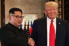 President Trump and North Korean leader Kim Jong Un shake hands on June 12 following their summit in Singapore. (Jonathan Ernst/Reuters)