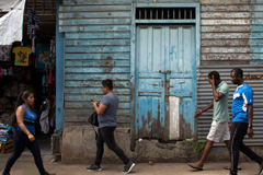 African migrants walk in the streets of Tapachula, heading to the central park. The arrival of African and other migrants is changing the demographics of this Mexican town. Enncarni Pindado