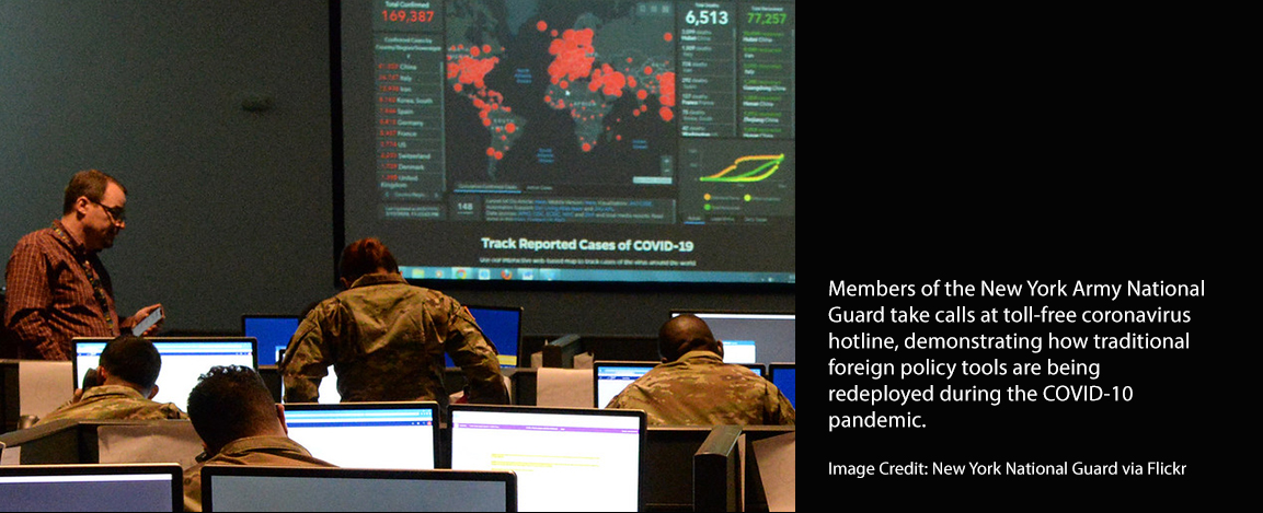 Members of New York National Guard take calls on a hotline for pandemic