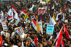 Iraqi demonstrators rally to mourn Iranian general Qasem Soleimani and an Iraqi paramilitary leader a year after they were killed in a US drone strike AHMAD AL-RUBAYE