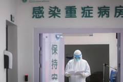 In a photo released by China’s Xinhua News Agency, a medical staff member wearing a protective suit works in the department of infectious diseases at Wuhan Union Hospital on Jan. 28. (Xiao Yijiu/Xinhua/AP)