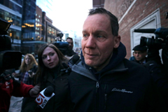 Harvard University professor Charles Lieber is surrounded by reporters as he leaves the Moakley Federal Courthouse in Boston Thursday. (Charles Krupa/AP)