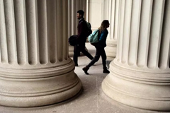 Students walked through pillars at MIT.