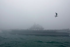 The Chinese aircraft carrier Liaoning, purchased from Ukraine, participates in a 2019 naval parade near Qingdao. (Mark Schiefelbein/Pool/AP)