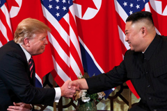 President Trump and North Korean leader Kim Jong Un shake hands at their summit in Hanoi last month. (Evan Vucci/AP)