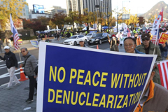 FILE - Protesters march toward the U.S. Embassy during a rally supporting the U.S. policy to put steady pressure on North Korea, in Seoul, South Korea, Nov. 3, 2018. 