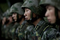 Soldiers of the Chinese People's Liberation Army 1st Amphibious Mechanized Infantry Division prepare to provide Chairman of the Joint Chiefs of Staff Adm. Mike Mullen with a demonstration of their capablities during a visit to the unit in China on July 12, 2011. Mullen is on a three-day trip to the country meeting with counterparts and Chinese leaders. (DoD photo by Mass Communication Specialist 1st Class Chad J. McNeeley/Released)