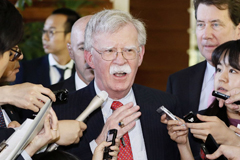 National security adviser John Bolton is surrounded by reporters at the Japanese prime minister’s official residence in Tokyo on Friday. (Yohei Kanasashi/AP)