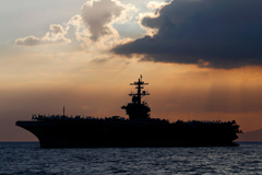 The aircraft carrier Theodore Roosevelt anchored off Manila Bay in 2018.Credit...Bullit Marquez/Associated Press