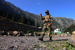 An Indian border security force soldier walks near a check post along the Srinagar-Leh National highway on Tuesday, following deadly clashes along the disputed border with China. Photograph: Anadolu Agency/Getty Images