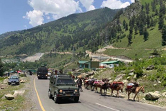 An Indian army convoy moves on the Srinagar-Ladakh highway at Gagangeer, north-east of Srinagar, on June 18, 2020.   | Photo Credit: AP