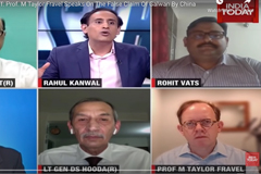 screenshot of people talking on news program