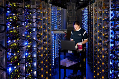 In this undated photo, an employee of Google diagnoses an overheated computer processor at the company's data center in The Dalles, Ore. Google uses these data centers to store email, photos, video, calendar entries and other information shared by its users. These centers also process the hundreds of millions of searches that Internet users make on Google each day. (Connie Zhou/AP/Google)