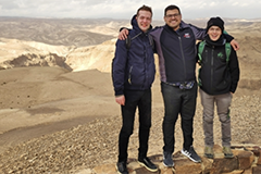 MIT graduate student Nicholas Rivera (middle) and two students from Professor Ido Kaminer's lab visit Masada National Park near the Dead Sea in Israel