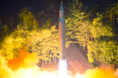 This July 28, 2017 photo released by North Korea's official Korean Central News Agency shows a Hwasong-14 intercontinental ballistic missile being lauched at an undisclosed location in North Korea. STR/AFP VIA GETTY IMAGES/GETTY