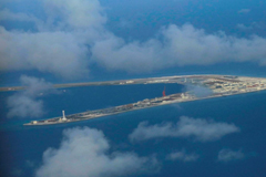 Chinese-held Subi Reef, a man-made island in the Spratly chain in the disputed South China Sea, is seen in April 2017. | POOL / VIA REUTERS