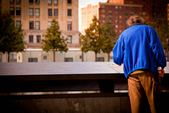 A man pauses by the National Sept. 11 Memorial in New York City. (Flickr/Sarah Le Clerc, https://flic.kr/p/dPcJkN; CC BY-ND 2.0, https://creativecommons.org/licenses/by-nd/2.0/)