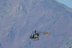 An Indian helicopter flies over a mountain range near the disputed border © AFP via Getty Images