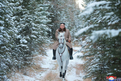 North Korean leader Kim Jong Un rides a horse in the snow on Mount Paektu in this image released Wednesday. | KCNA / VIA REUTERS