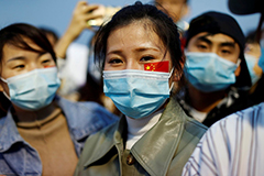 Young Chinese woman with face mask 