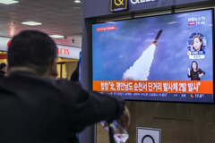 People watch a television broadcast reporting the North Korean missile launch at the Seoul Railway Station on October 31, 2019 in Seoul, South Korea.